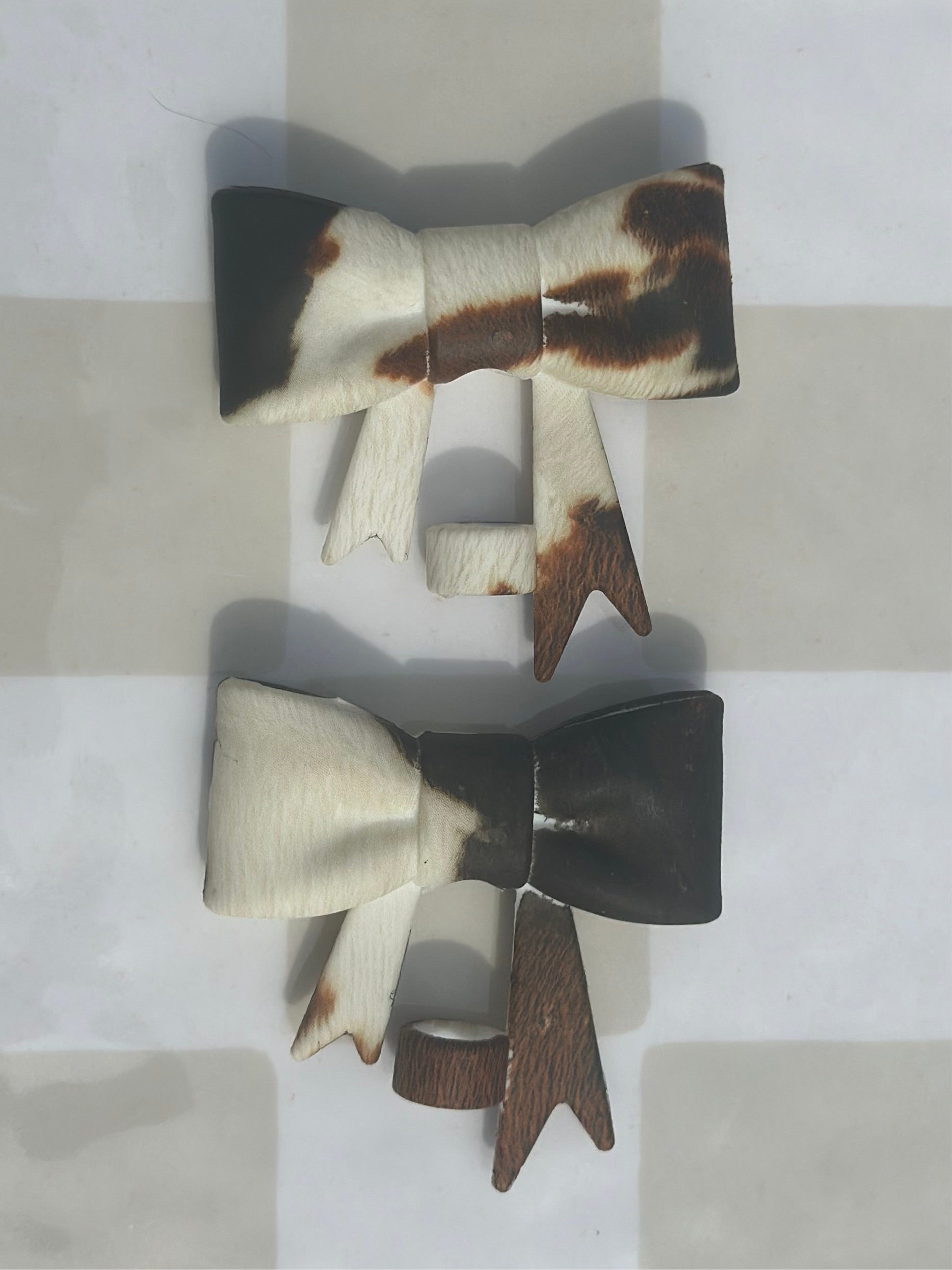 Brown and White cowhide bow strawtopper
