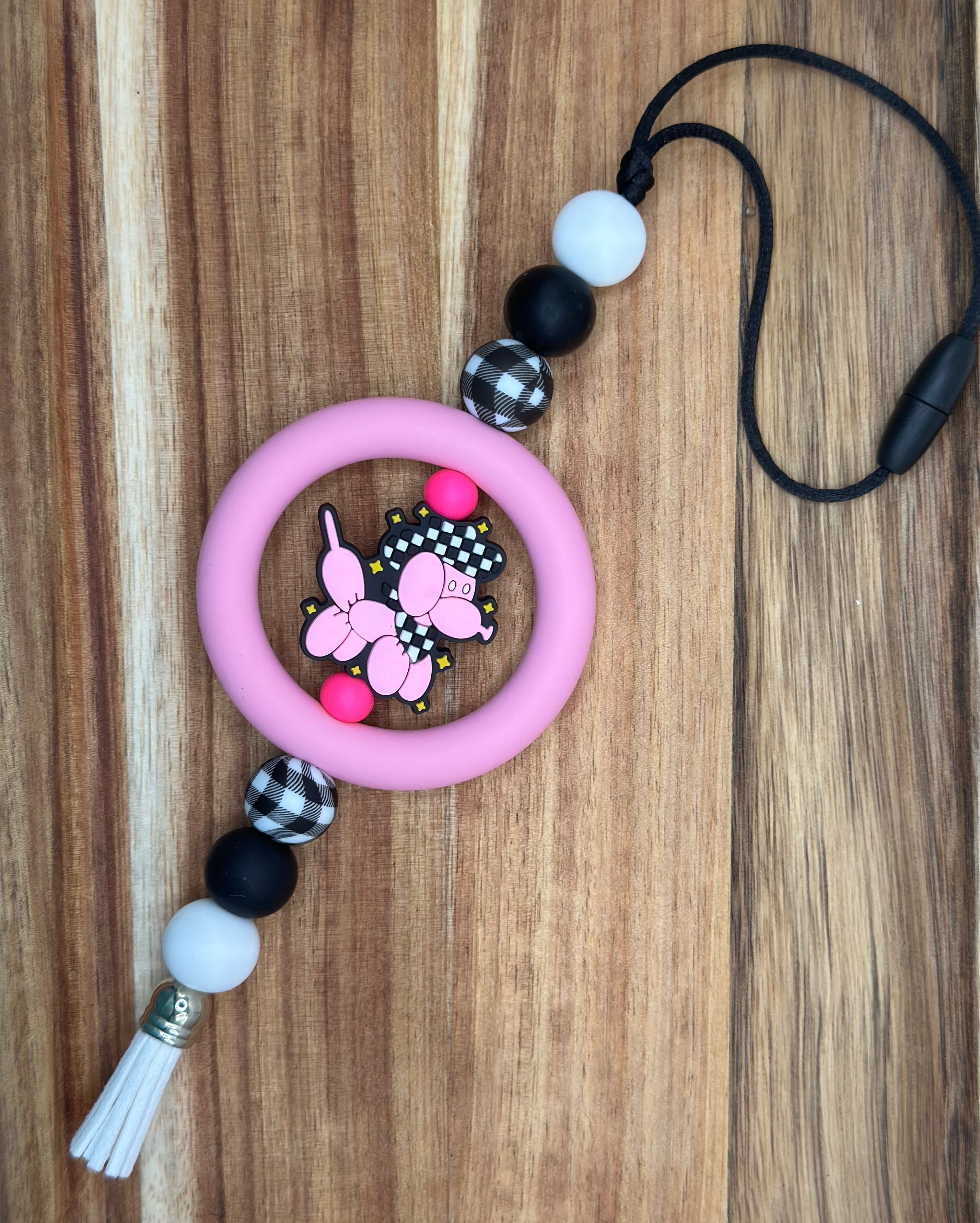 Pink and checkered ballon dog car charm
