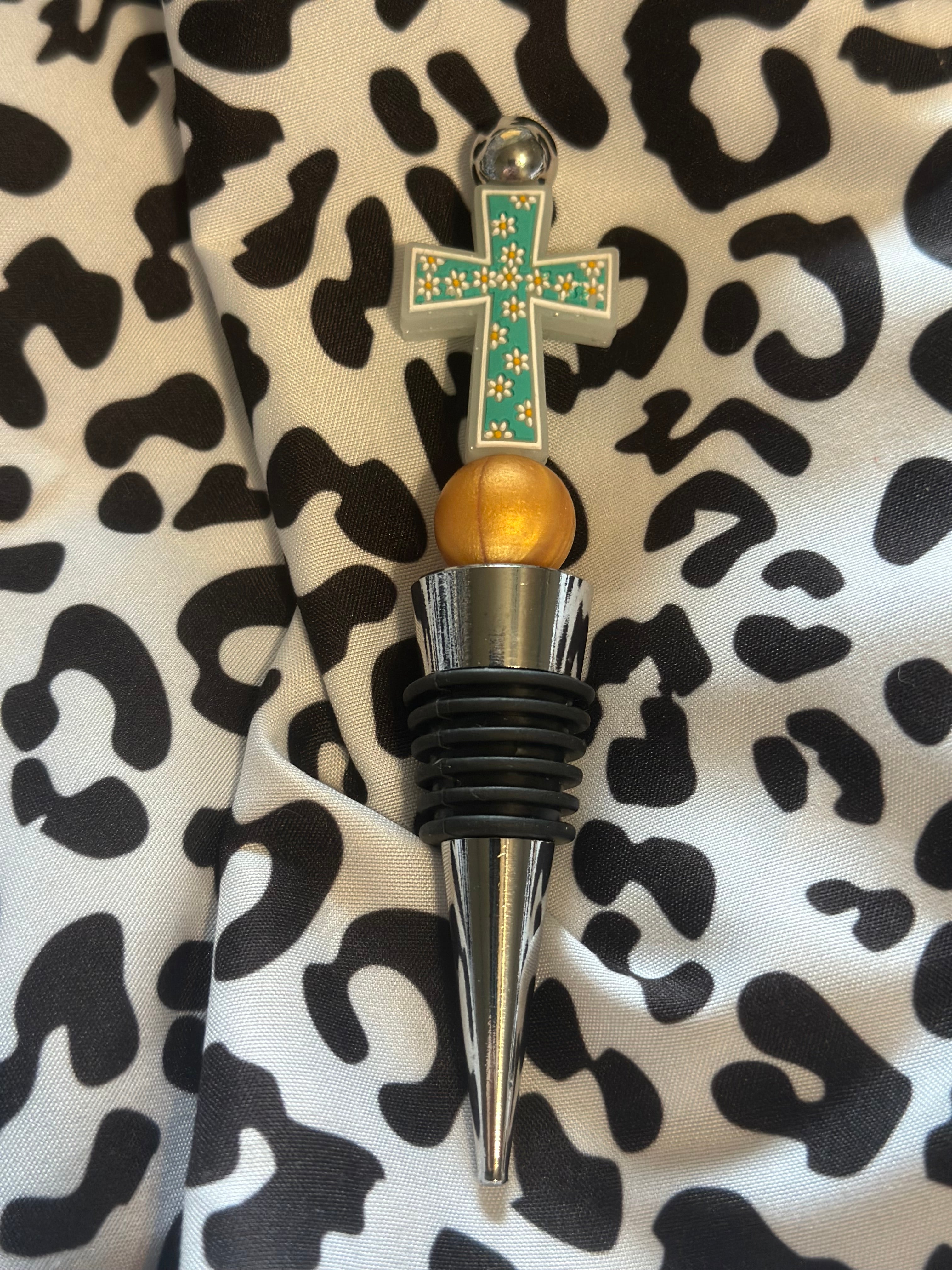 Teal cross wine stopper
