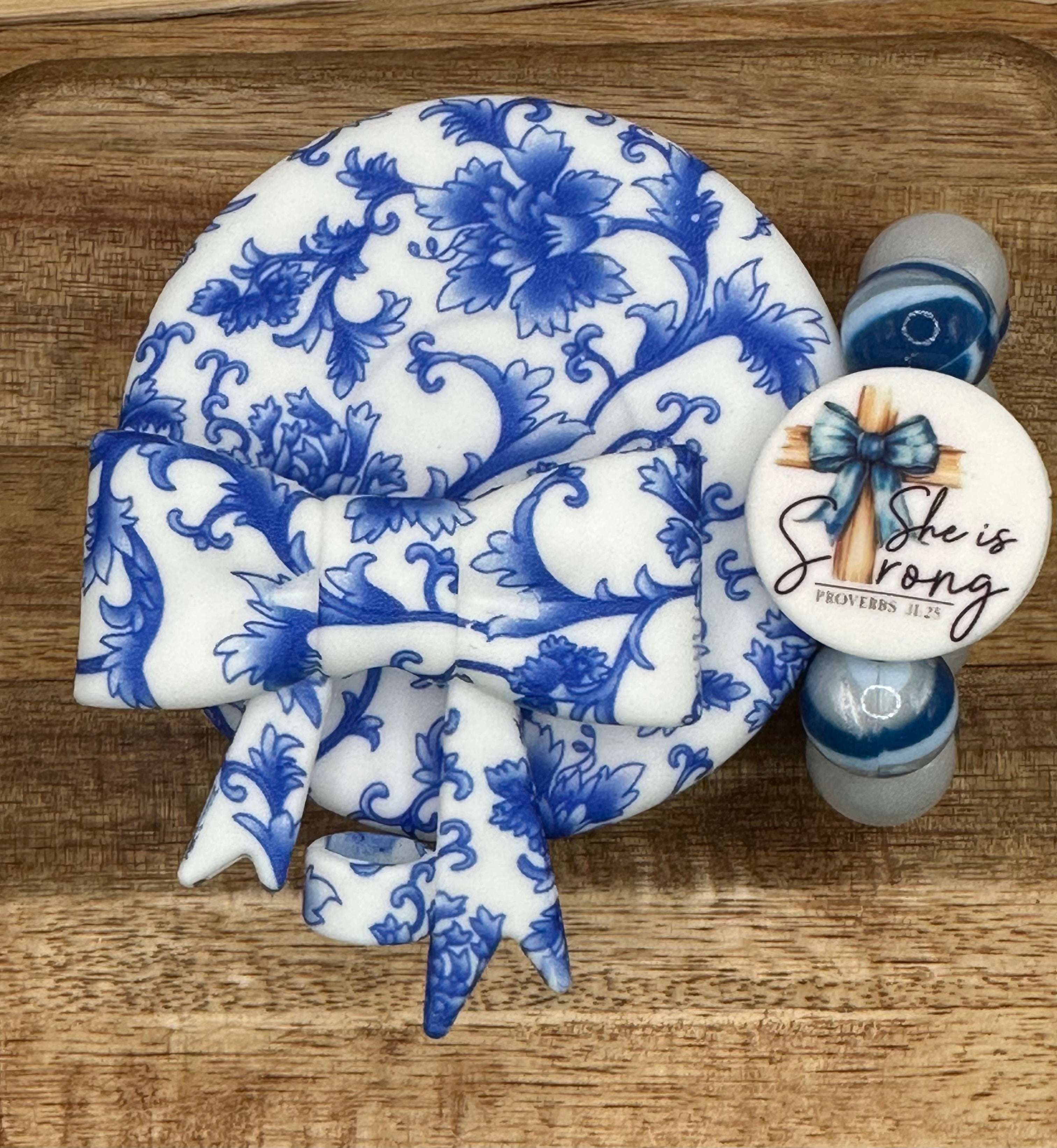 Blue and white flower swirl “She is Strong”