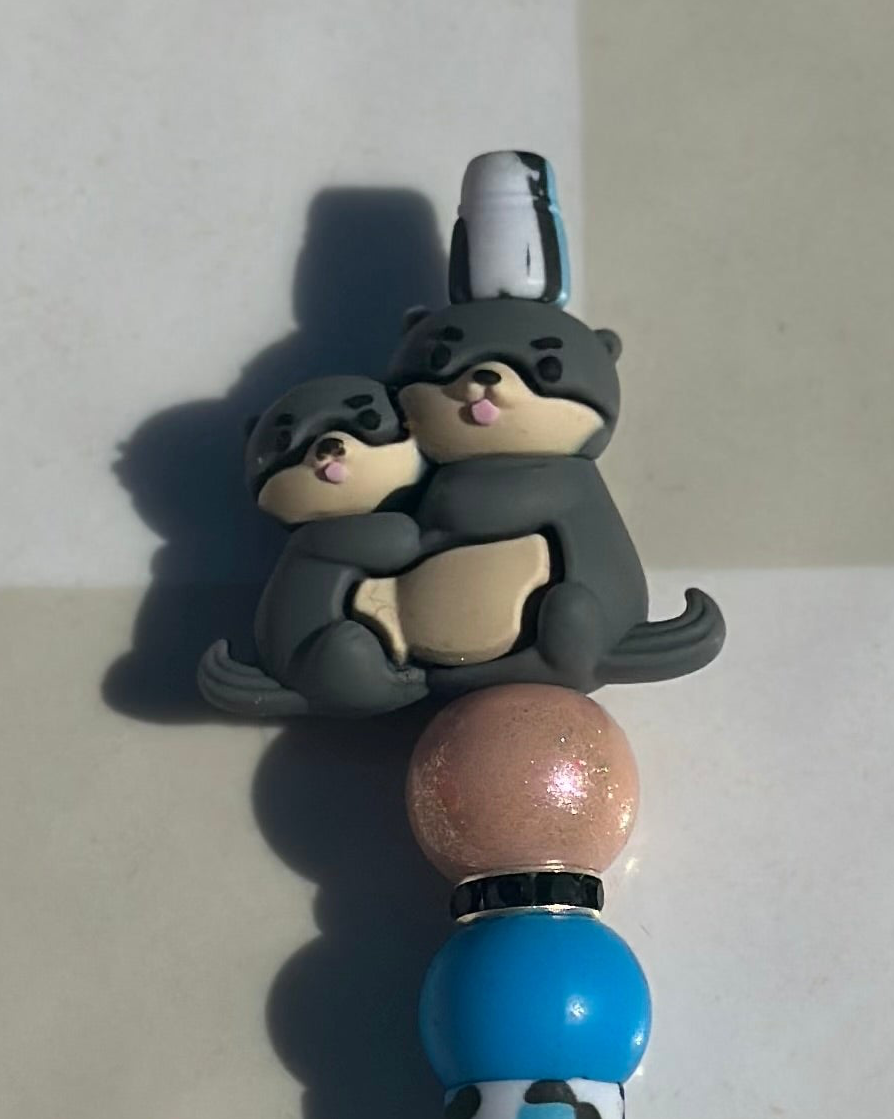 Otter mom and baby beaded pen